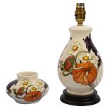 A Moorcroft 'Sandringham Bouquet' pattern table lamp and vase