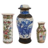Two late 19th century Chinese Canton famille rose vases and a crackle glaze baluster vase and cover