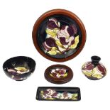 A group of five Moorcroft 'Magnolia Dark Blue' pattern pieces