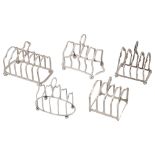 Five George V silver toast racks