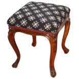 A Victorian walnut footstool