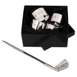 A set of four modern silver napkin rings and a novelty golf club letter opener