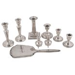 A collection of silver to include assorted dwarf candlesticks with weighted bases, a pair of George