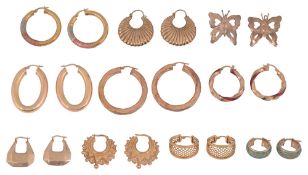 Nine pairs of mostly 9ct gold continental hoop earrings