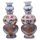 A near pair of Chinese blue and white and copper underglaze vases, late 19th/early 20th century
