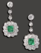 A pair of emerald and diamond-set ear pendants