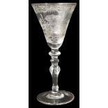 A Dutch engraved armorial light baluster goblet c.1760 in the manner of Jacob Sang