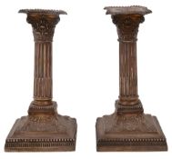 A pair of late Victorian Corinthian column dwarf candlesticks