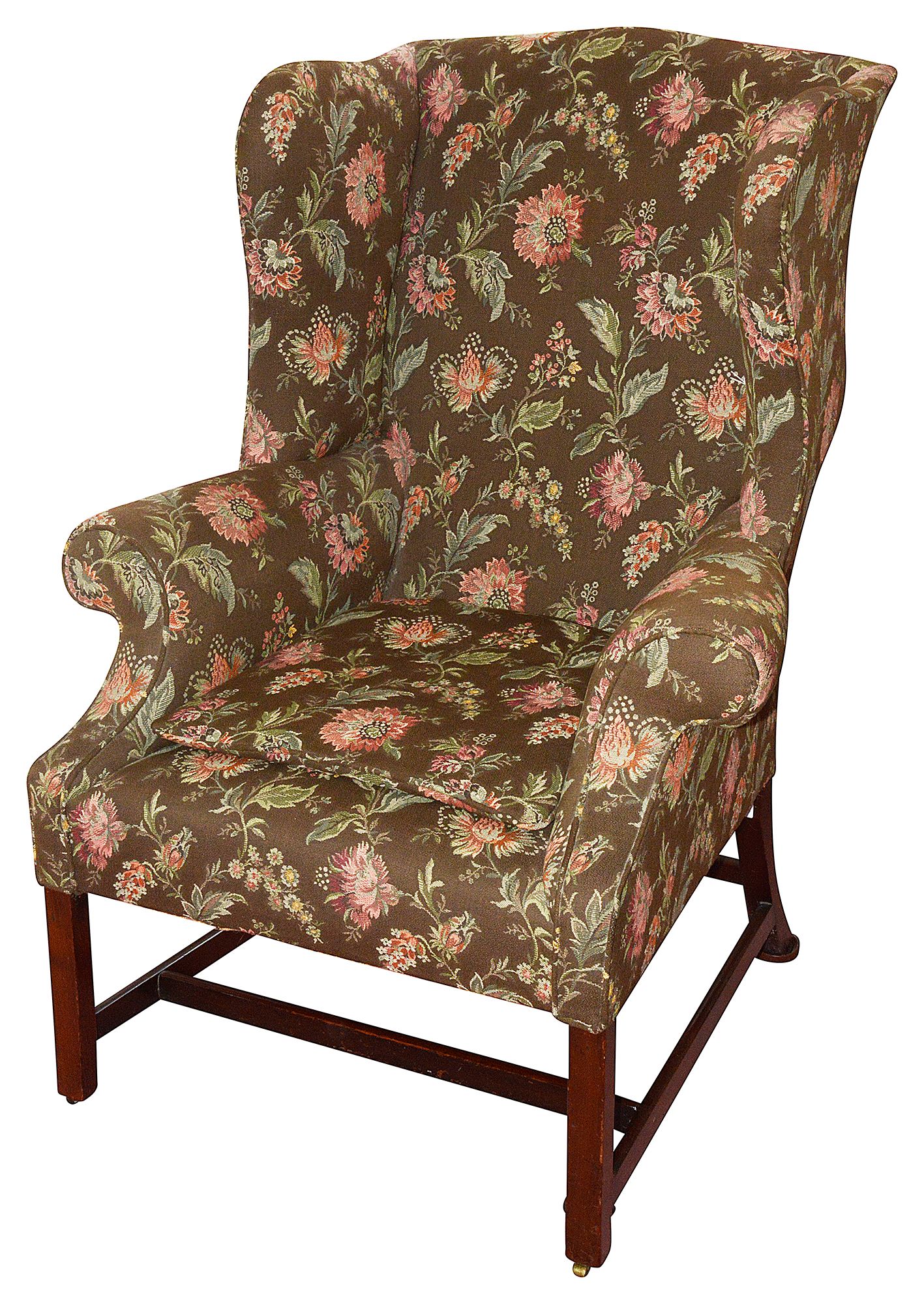 A George III mahogany and upholstered wing back armchair