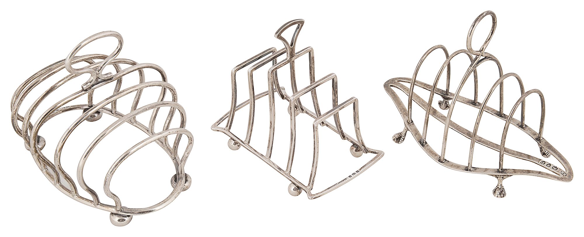 Three English silver toast racks