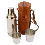 A stitched tan leather cased chrome plated picnic Thermos flask