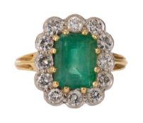 An emerald and diamond-set cluster ring