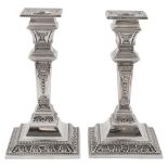 A pair of Edwardian silver Neoclassical Adam design dwarf candlesticks