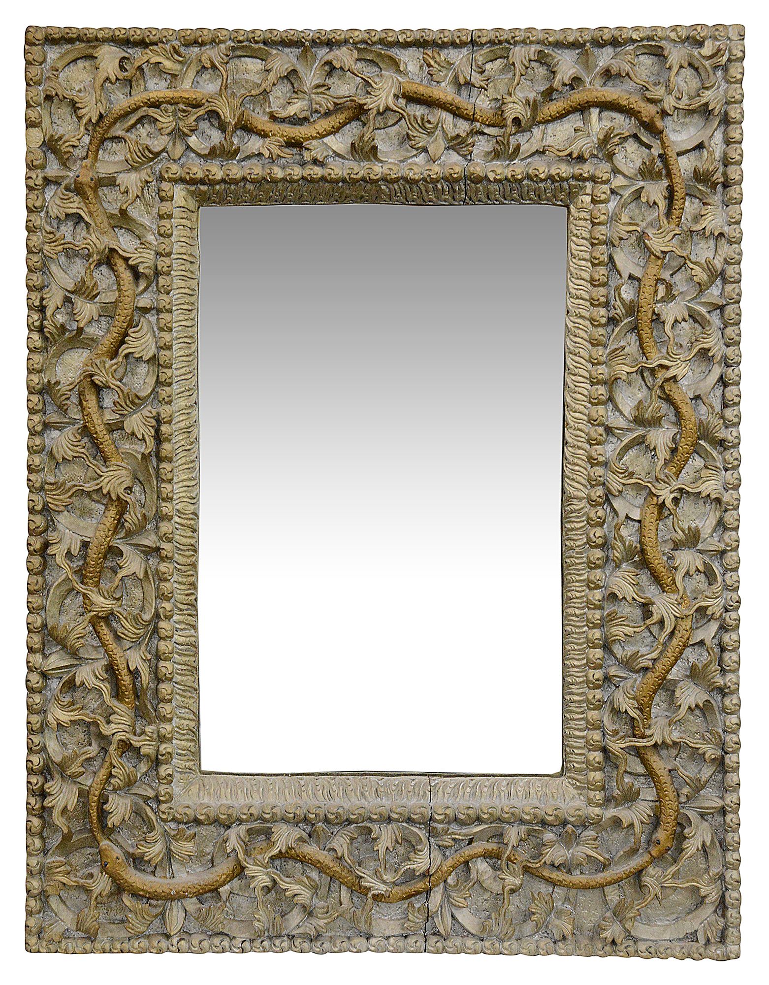 An Indian carved wood mirror