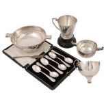A George V presentation silver quaich, cased sets of coffee spoons and cake forks, a christening cup