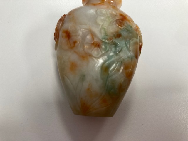 A Chinese carved coral snuff bottle and stopper and a russet celadon jade snuff bottle and stopper - Image 2 of 9