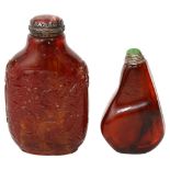 Two Chinese amber snuff bottles and stoppers