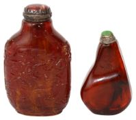 Two Chinese amber snuff bottles and stoppers