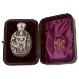 A late 19th century cased Indian silver scent bottle