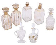 Two pairs of French cut glass and gilt spirit decanters together with two bottles and two oil bottle
