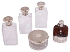 A late silver an hip flask, a George VI set of three silver mounted glass scent bottles and matching