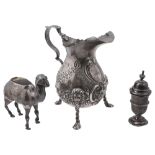 A late Victorian silver novelty camel pin cushion, a cream jug and a pepper pot