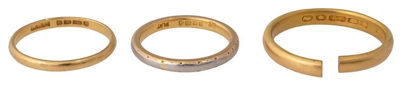 A 22ct gold and platinum wedding band and two 22ct gold wedding bands