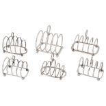 Six Edwardian and later silver toast racks