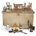 A 19th century trunk with 19th century and later dolls house furniture and accessories