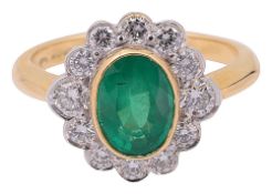 An emerald and diamond-set cluster ring
