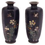 A mirror pair of Japanese Meiji Period cloisonne enamel vases