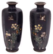 A mirror pair of Japanese Meiji Period cloisonne enamel vases