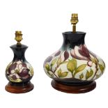 Two Moorcroft 'Magnoila' Dark Blue pattern large and small table lamps