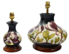 Two Moorcroft 'Magnoila' Dark Blue pattern large and small table lamps