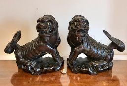 PAIR OF HARDWOOD SHI-SHI TEMPLE DOGS, APPROXIMATELY 22cm HIGH DAMAGE TO ONE TAIL