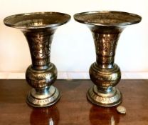 PAIR OF BRASS AND SILVERED ORIENTAL VASES HAVING FLARED RIMS, APPROXIMATELY 23cm HIGH