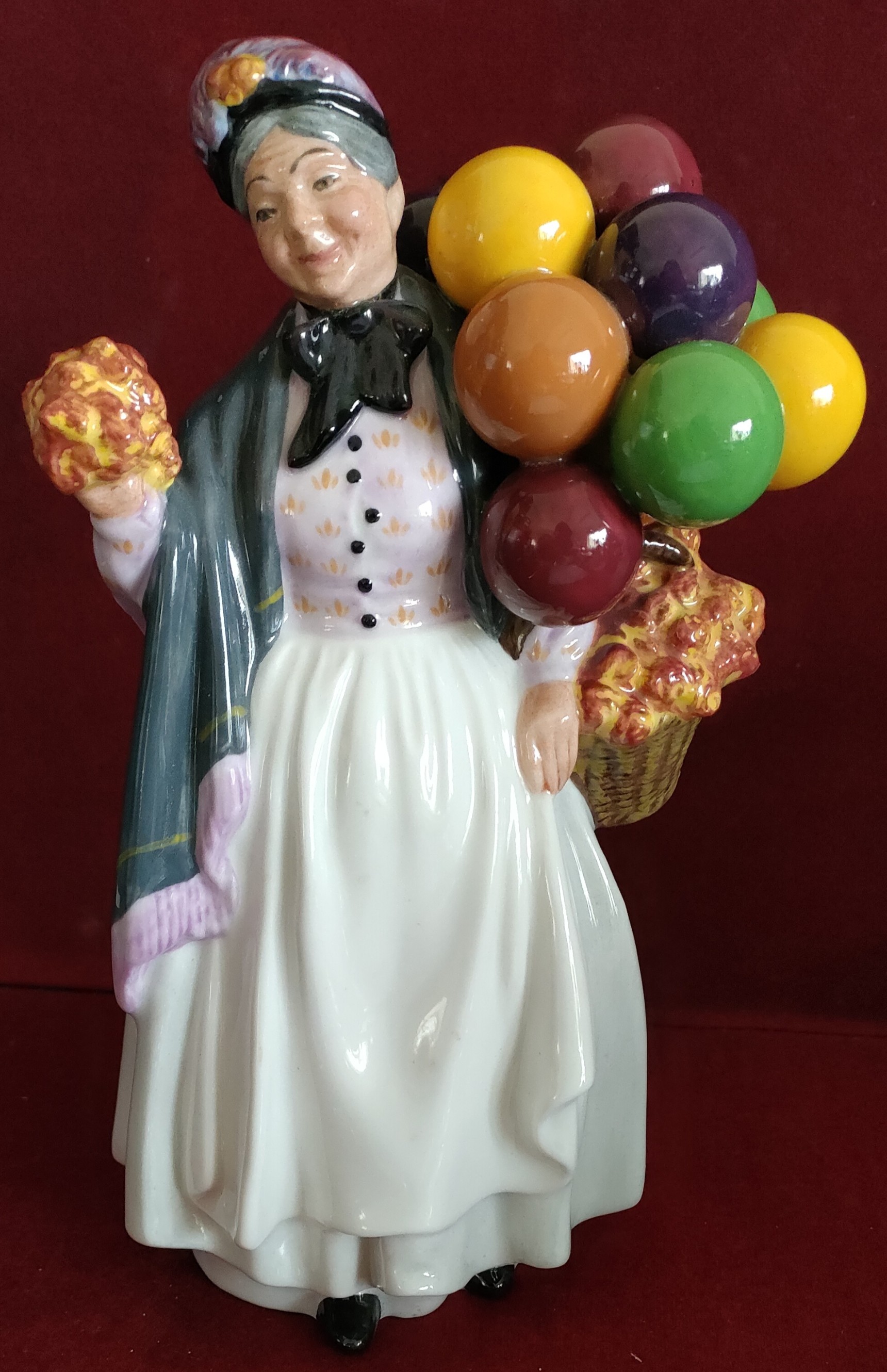 ROYAL DOULTON GLAZED CERAMIC FIGURE - BIDDY PENNY FARTHING, HN1843 IN REASONABLE CONDITION