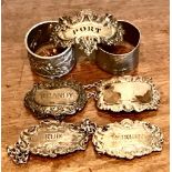 TWO SILVER NAPKIN RINGS, TWO HALLMARKED SILVER WINE LABELS, TWO UNHALLMARKED SILVER WINE LABELS