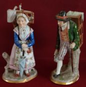 TWO SITZENDORF HANDPAINTED AND GILDED FIGURES DEPICTING A LADY AND GENT CARRYING BASKETS ON BACK