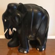 EBONISED FIGURE OF AN ELEPHANT, APPROXIMATELY 26cm HIGH SOME DAMAGE TO FOOT