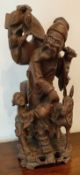 HEAVILY CARVED ORIENTAL WOODEN FIGURE GROUP OF A GENT WITH CHILD AND DONKEY, APPROXIMATELY 43cm HIGH