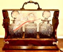 THREE DECANTER TANTALUS IN WALNUT FRAME, BETJAMIN'S & CO MAKERS, PAT No 44676, APPROXIMATELY 33 x 29