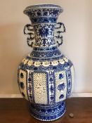 CONTEMPORARY 20th CENTURY ORIENTAL VASE WITHIN PIERCED DECORATION GLOBULAR STAND, APPROXIMATELY 53cm