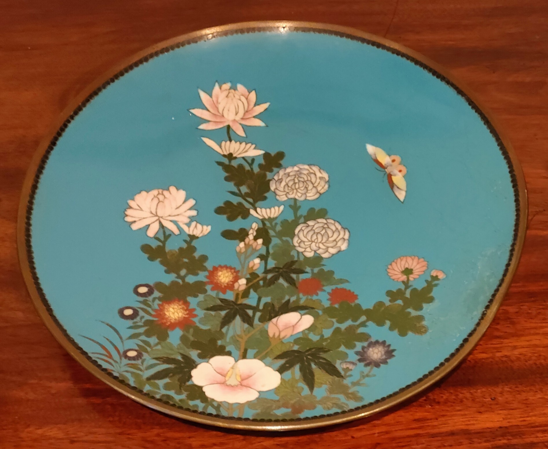 GLAZED CLOISONNE CIRCULAR PLAQUE DECORATED WITH FLOWERS, DIAMETER APPROXIMATELY 30cm USED, SOME