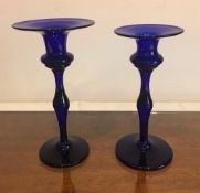 TWO DISSIMILAR BRISTOL BLUE GLASS CANDLESTICKS, DATE UNKNOWN, WEAR MARKS TO BASE, APPROXIMATELY 18cm