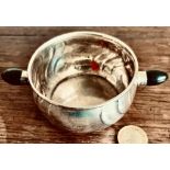 SILVER COLOURED TWO HANDLED BOWL, MARKS INDISTINCT. WEIGHT 80G