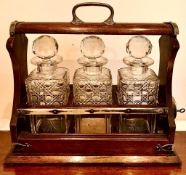THREE DECANTER OAK CASED TANTALUS WITH KEY, APPROXIMATELY 34 x 30 x 15cm