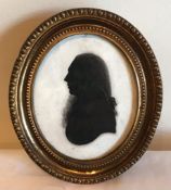 OVAL SILHOUETTE IN BRASS OVAL FRAME WITH REVERSE INSCRIPTION, CIRCA 1820, APPROXIMATELY 8 X 7cm