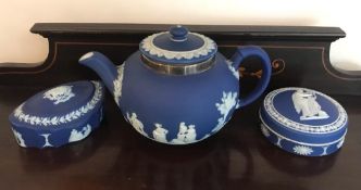 THREE PIECES OF WEDGWOOD, THE TEAPOT HAVING SILVER HALLMARKED BAND