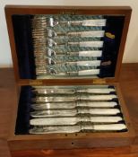 CASED SET OF TWELVE SILVER BANDED AND MOTHER OF PEARL HANDLED FISH KNIVES AND FORKS REASONABLE